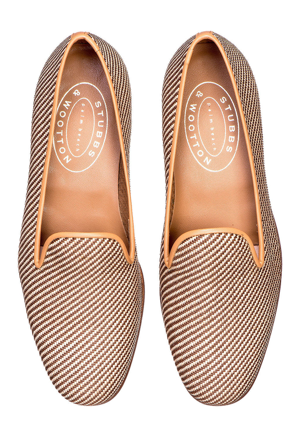 Top view of Straw Raffia Slipper pair showing woven natural straw upper and tan leather trim on white background