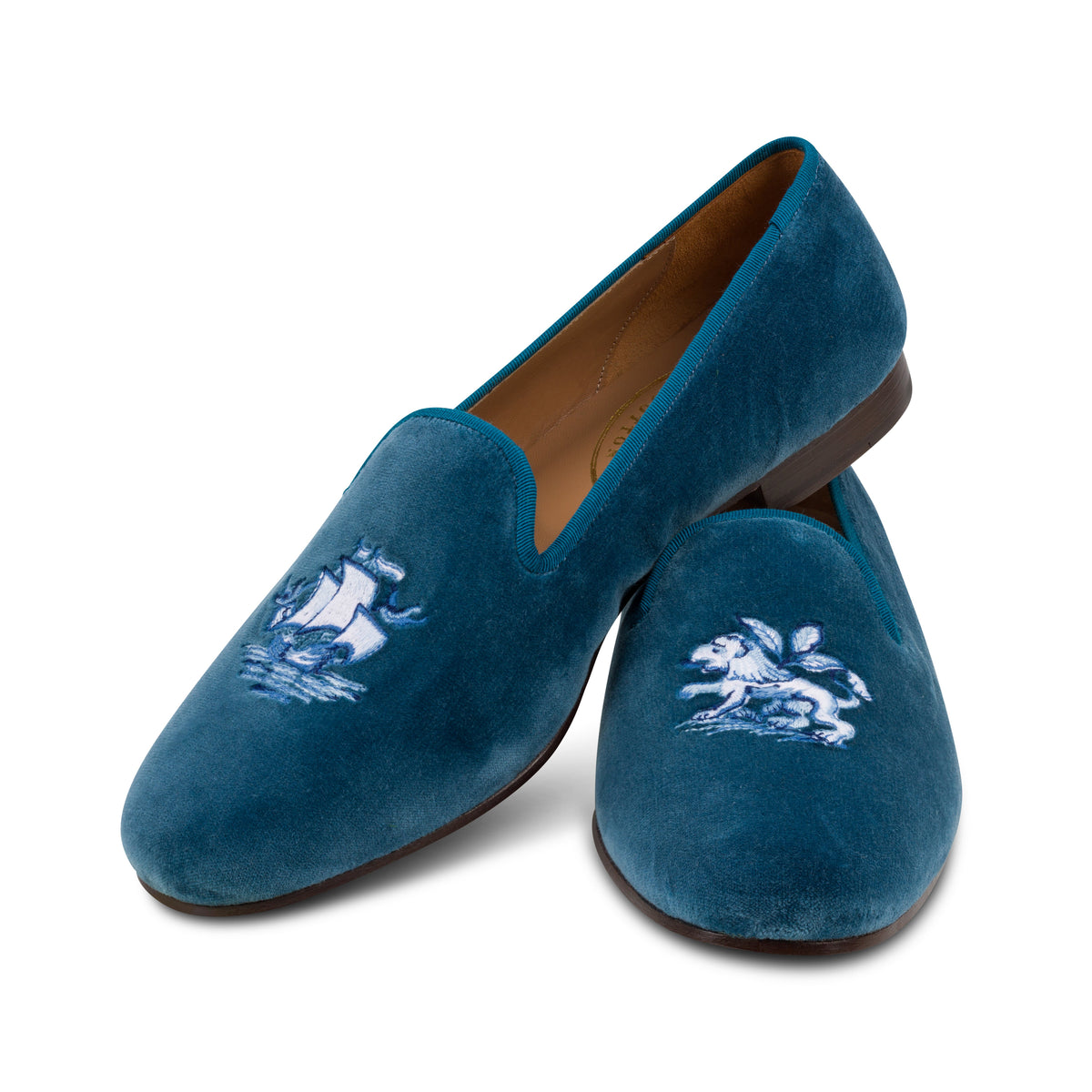 Our blue delft slipper on a white background.