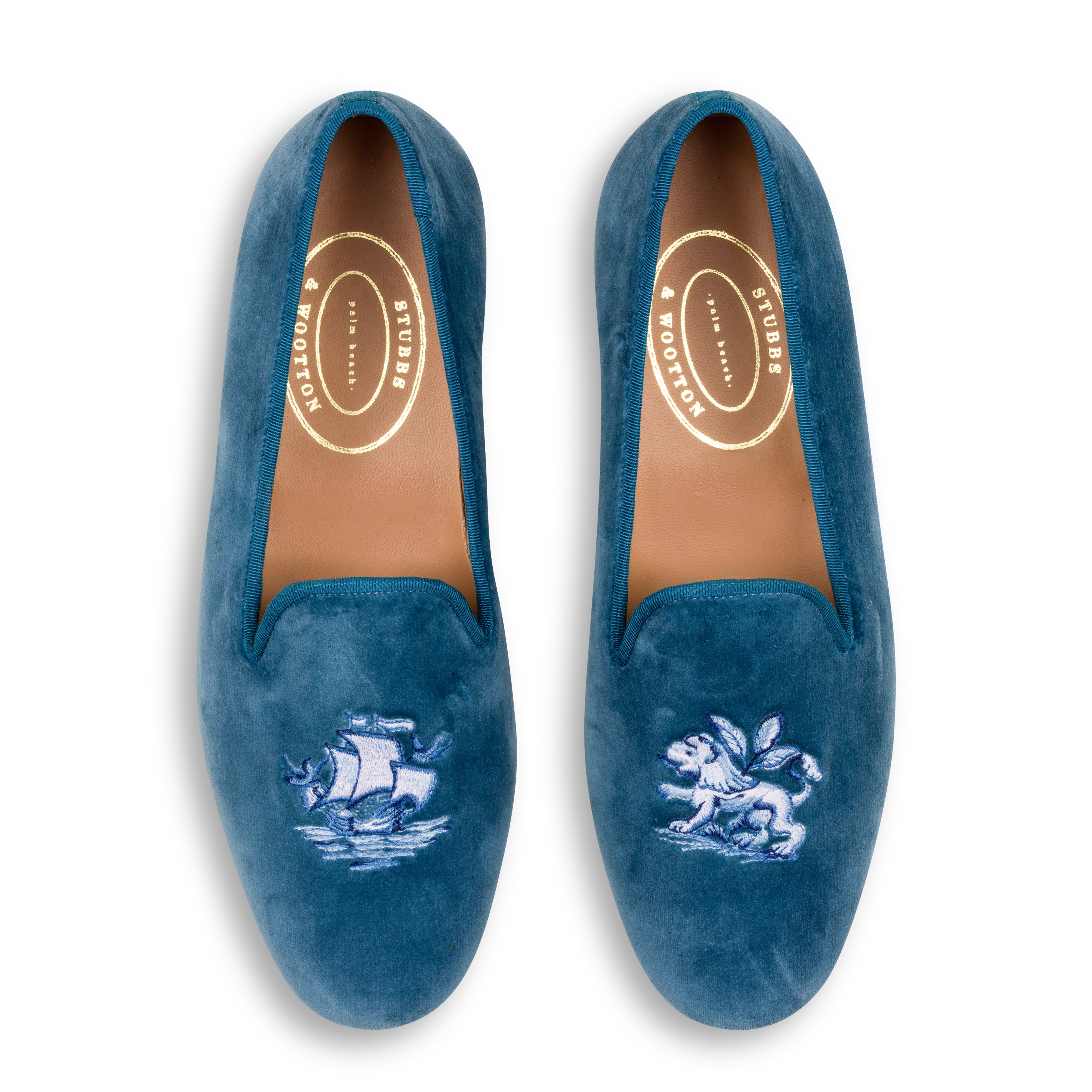 Our blue delft slipper on a white background.