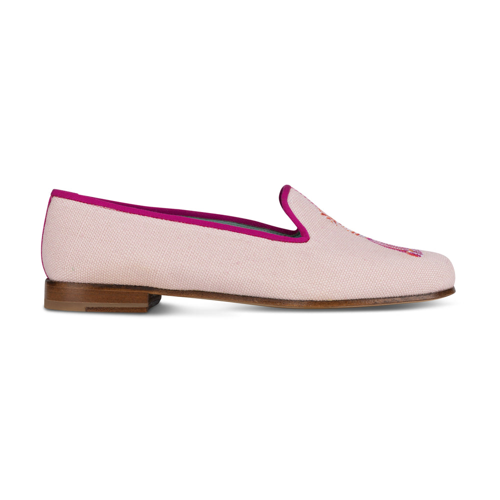 Side view of Tassel Blush Linen Slipper showing blush linen upper, fuchsia trim, tassel embroidery and low stacked wooden heel