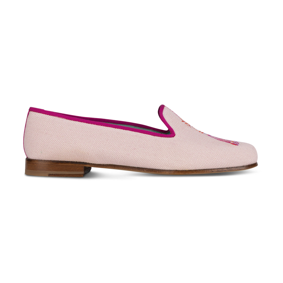 Side view of Tassel Blush Linen Slipper showing blush linen upper, fuchsia trim, tassel embroidery and low stacked wooden heel