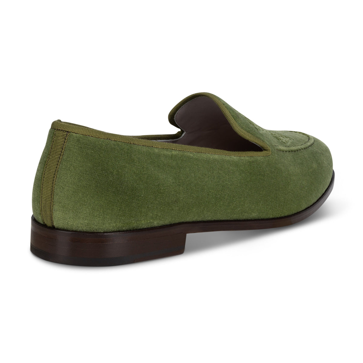Side view of men’s Lattice Sage Venetian loafer showcasing green velvet upper and stacked leather heel on white background