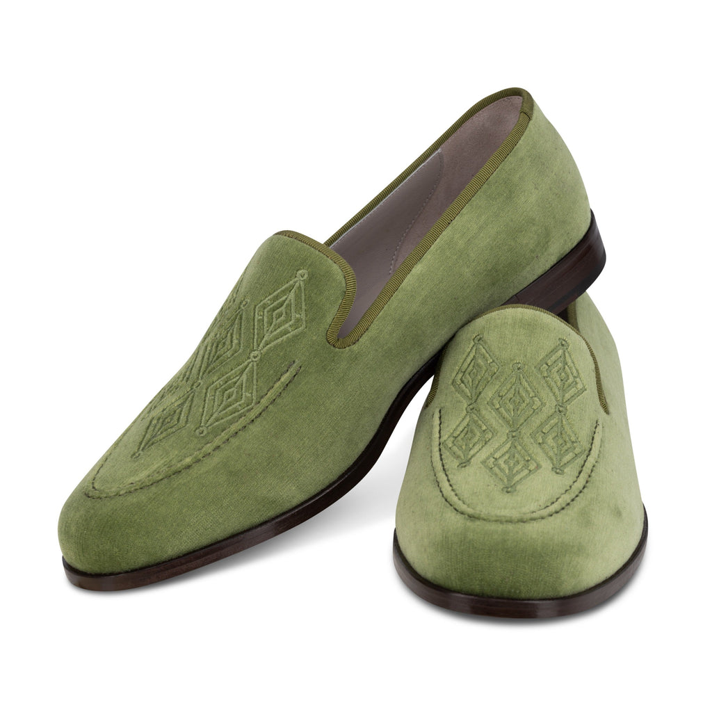 Three-quarter view of Men’s Lattice Sage Venetian loafers showcasing green velvet and lattice embroidery on a white background