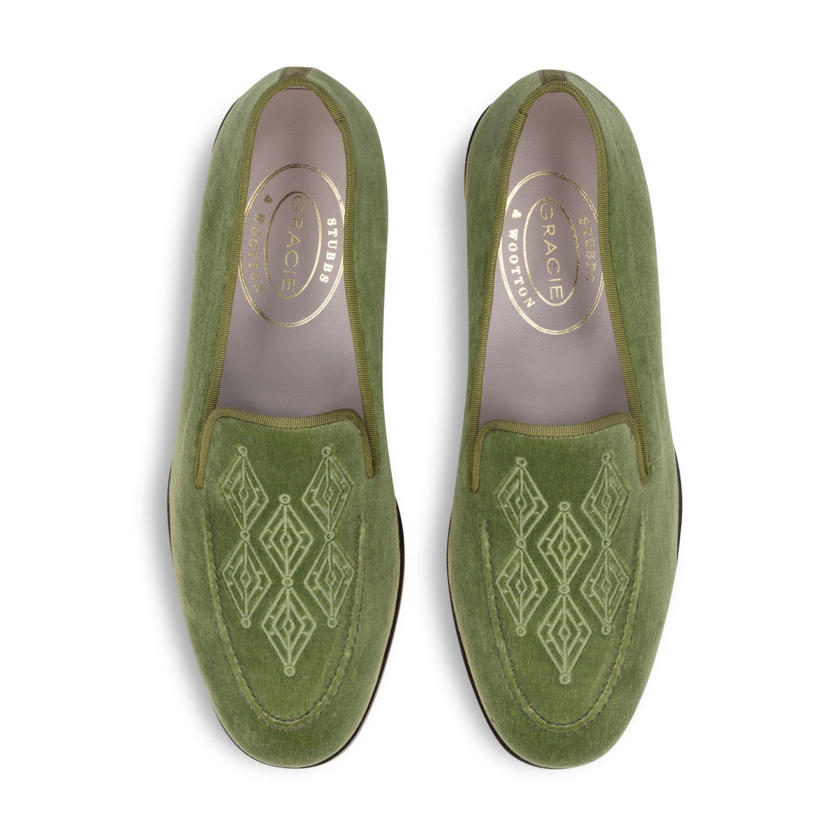 Top view of men’s Lattice Sage Venetian loafers showcasing green velvet, matching grosgrain trim, and lattice embroidery on a white background