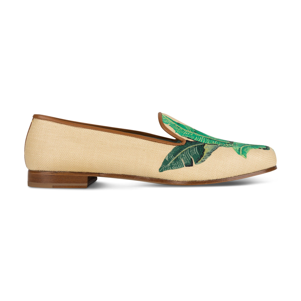 Side view of Brazilliance Panama slipper showing Panama weave with green philodendron embroidery and brown trim on white