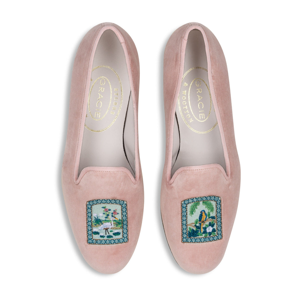 Top view of Paradiso Vignette Blush slipper showcasing tropical bird and foliage embroidery on blush velvet with a white background
