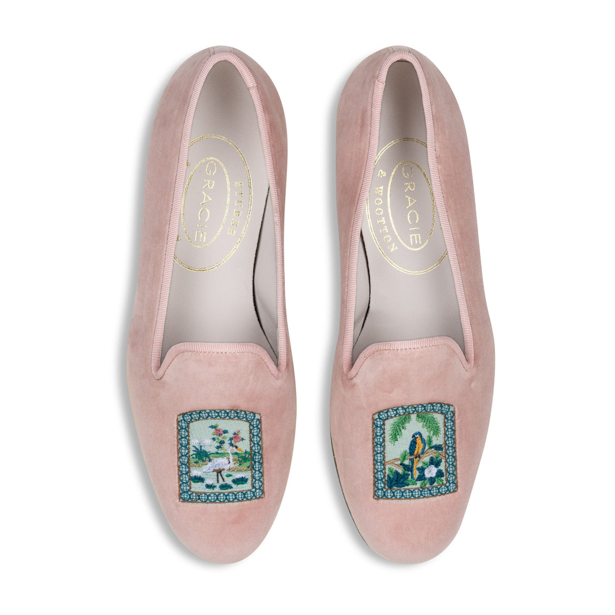 Top view of Paradiso Vignette Blush slipper showcasing tropical bird and foliage embroidery on blush velvet with a white background