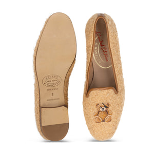 Top and bottom views of the Teddy Oatmeal Bouclé Slipper showcasing teddy bear embroidery and leather soles on white