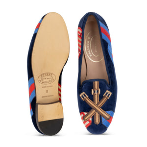 Top and sole views of the Paddock Naval Slipper showcasing crossed leather tack embroidery over striped racing silks with a white background