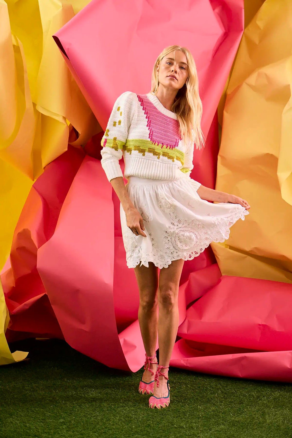 The Corrine Mini Skirt is in Battenberg white lace, clean waistband, and side-seam pockets.