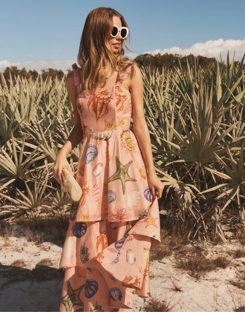 Darling Convertible Midi Dress in Seashell Symphony linen with strappy bodice, removable tiers, and convertible midi-to-mini silhouette.