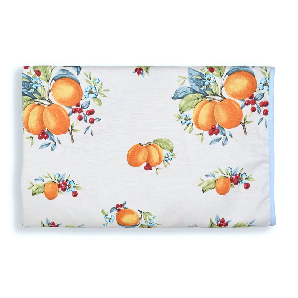 Folded view of Summer Basket tablecloth showcasing orange fruit-and-floral print on a white background with light blue trim