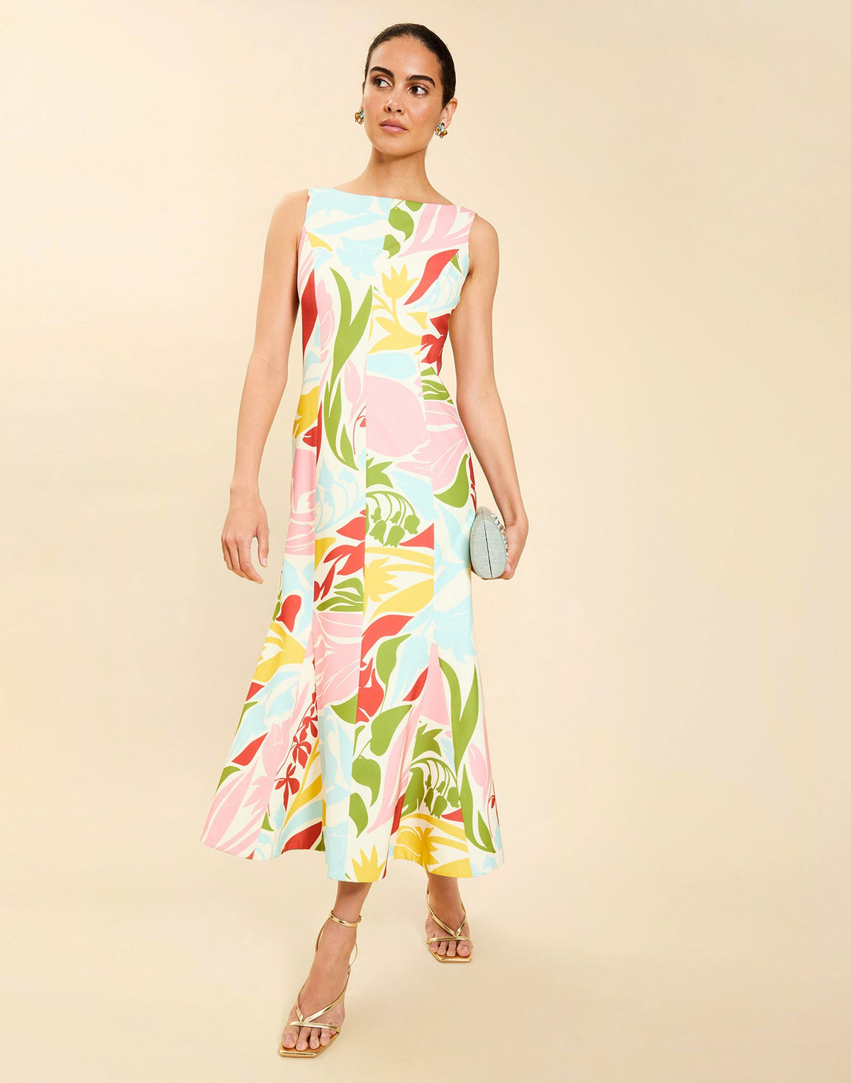 Woman wearing the Mestiza Sunnyside Convertible Midi Dress in Tuscan Daydreaming print, featuring a convertible neckline, fitted bodice, fit-and-flare skirt, and lightweight stretch crepe fabrication.