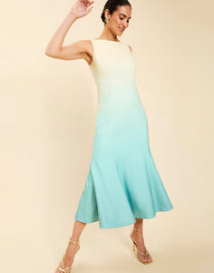 Woman wearing the Mestiza Sunnyside Convertible Midi Dress in Tuscan Daydreaming print, featuring a convertible neckline, fitted bodice, fit-and-flare skirt, and lightweight stretch crepe fabrication.