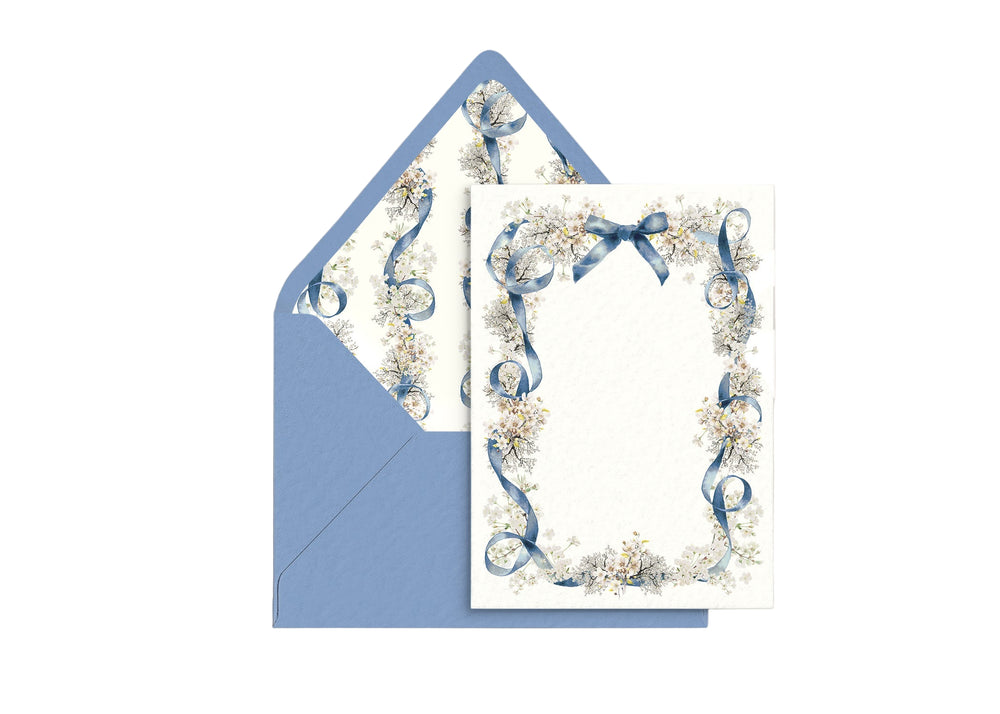 Front view of Swan Lake personal stationery showing a blue ribbon and floral border with matching blue envelope on a white background