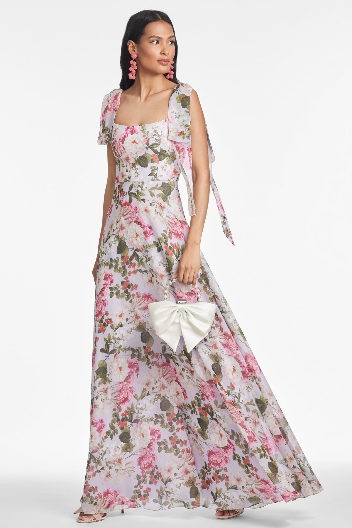 Front view of Pearl Gown in Petit Periwinkle and Petals showcasing floral printed chiffon, draped bodice, and sweeping skirt on model