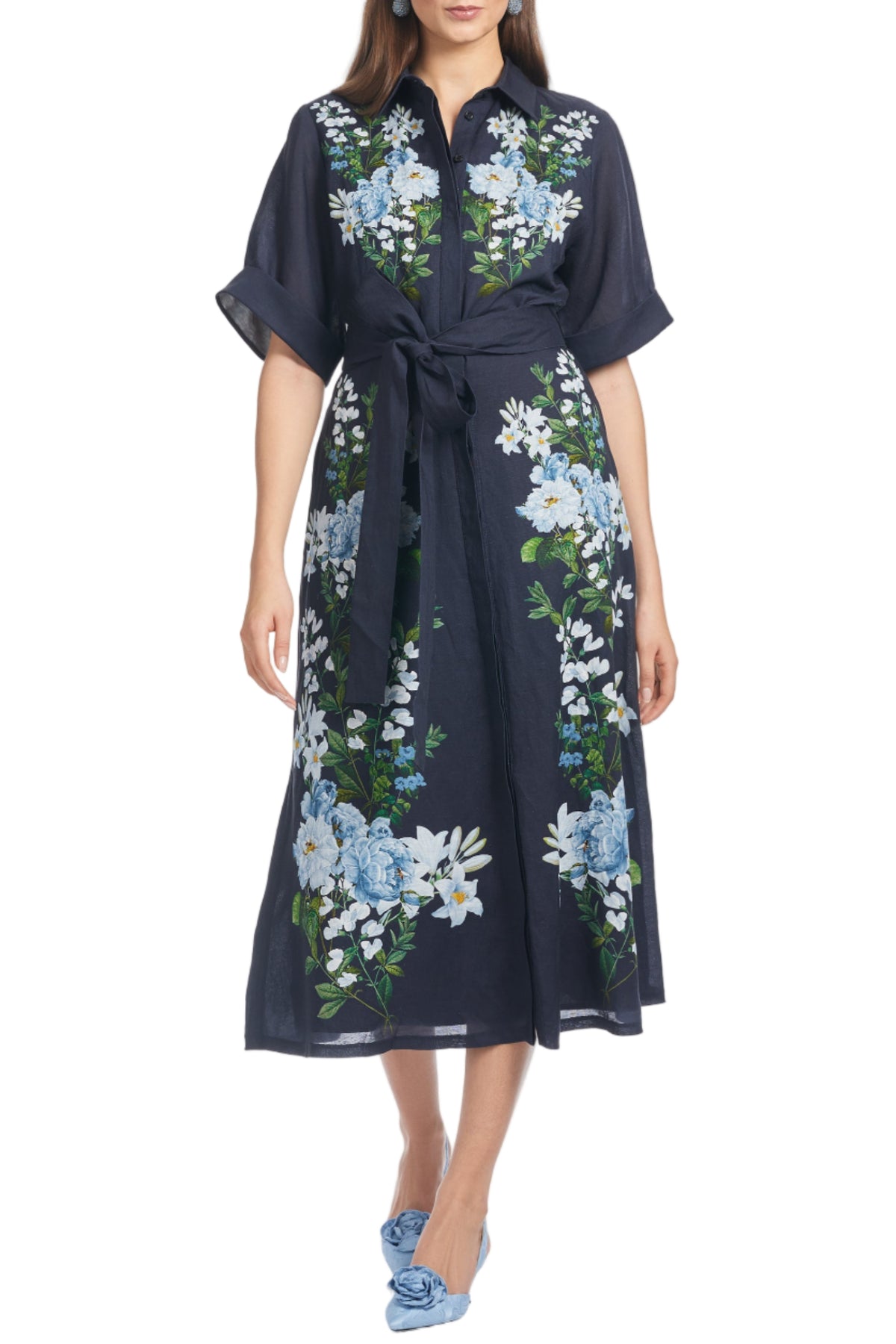 Front view of Joy Dress in Midnight Garden, navy floral shirt dress with short cuffed sleeves, tie waist, midi on white