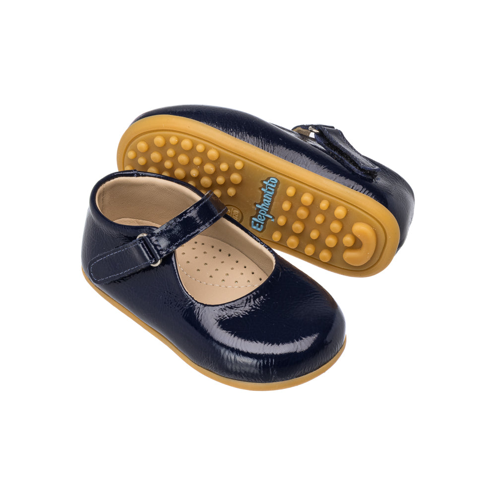 Angled view of Toddler Bare Mary Jane in Blue showcasing cracked patent leather and hook and loop strap on a white background