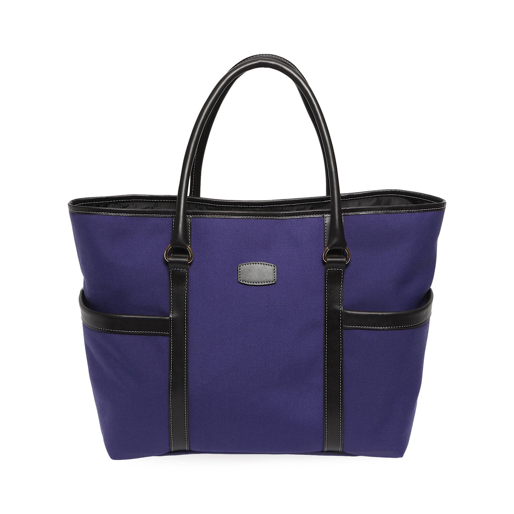 Front view of Town and Country Tote in purple canvas with black leather trim, two exterior pockets, and double top handles