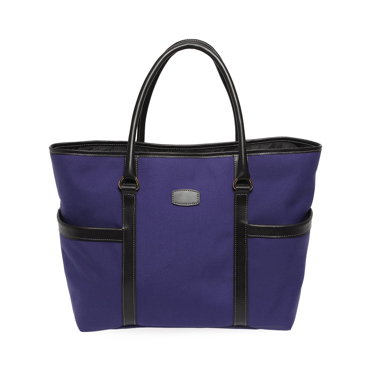 Front view of Town and Country Tote in purple canvas with black leather trim, two exterior pockets, and double top handles