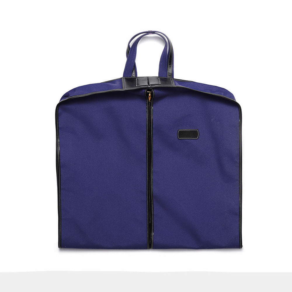 Front view of navy blue garment carrier showcasing center zipper, black leather trim and top handles on white background