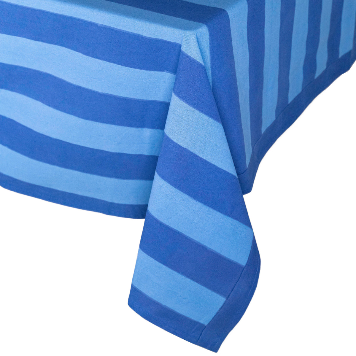 Close-up of Elena Green Stripe Tablecloth showcasing its alternating stripe motif and draped fabric against a white background