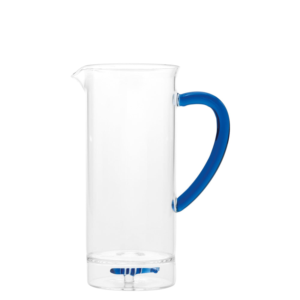 Front view of Teca Mare Carafe showing tall clear cylindrical body, pouring spout, and blue handle on white background