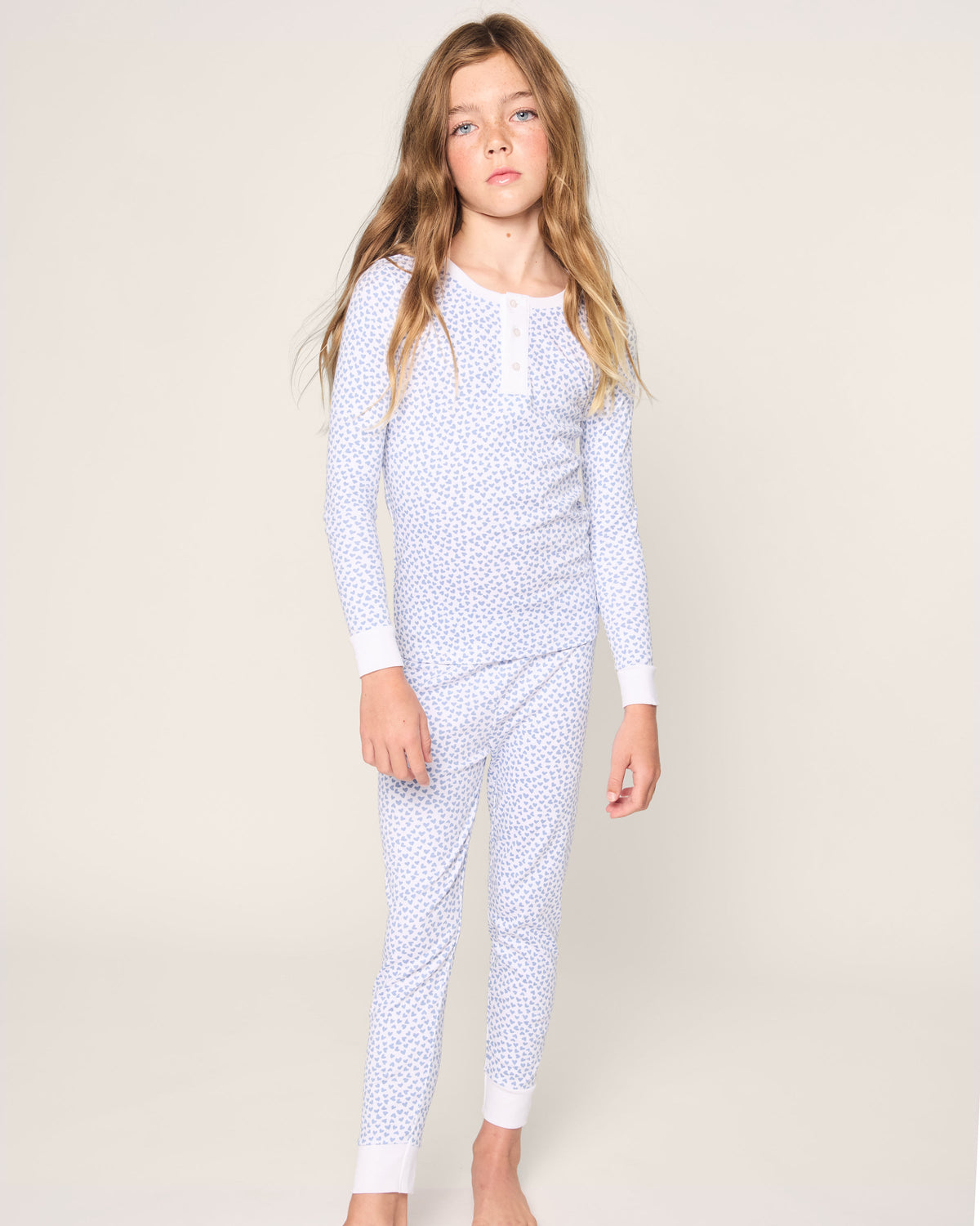Front view of Kid’s Pima Snug Fit Pajama Set in Bluehearts showcasing blue heart print and snug fit on a child