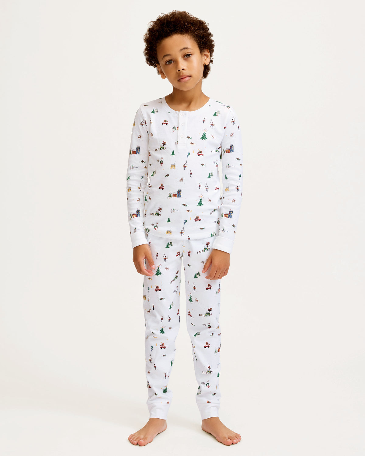 Front view of Kid’s Pima Snug Fit Pajama Set in Holiday Town showcasing white holiday village print on a plain background