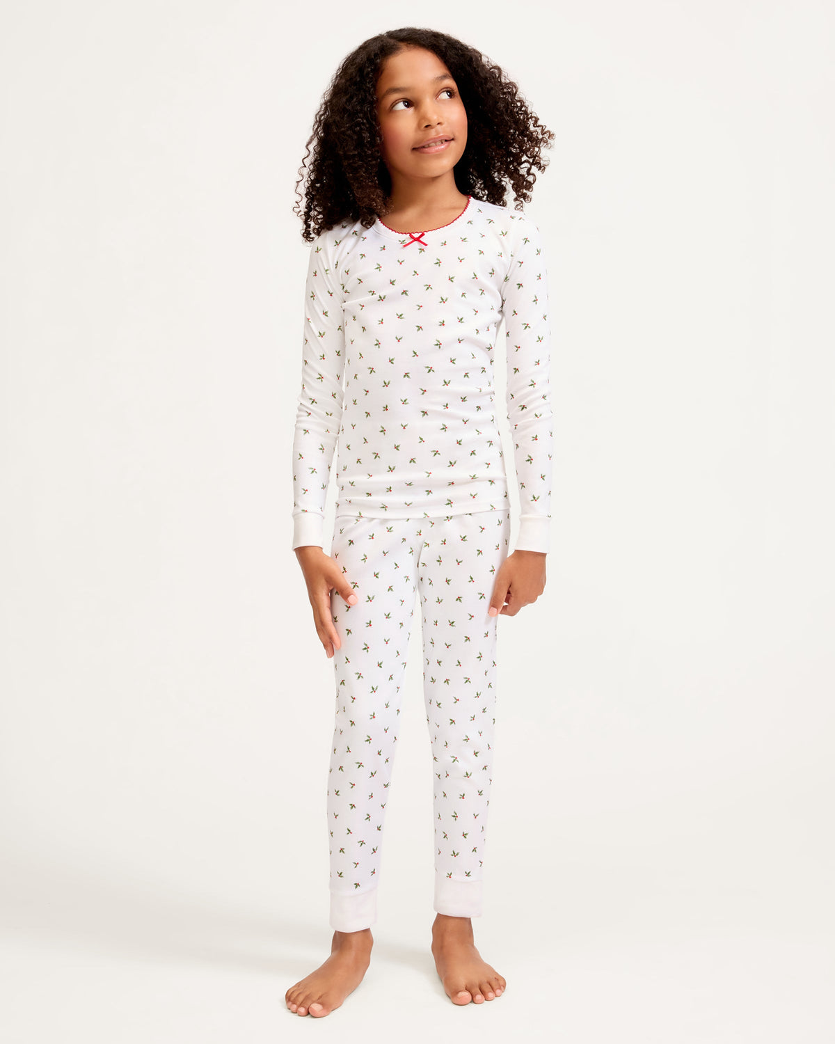 Front view of Kid’s Pima Snug Fit Pajama Set in Mistletoe Moments showing mistletoe print and snug fit on a child