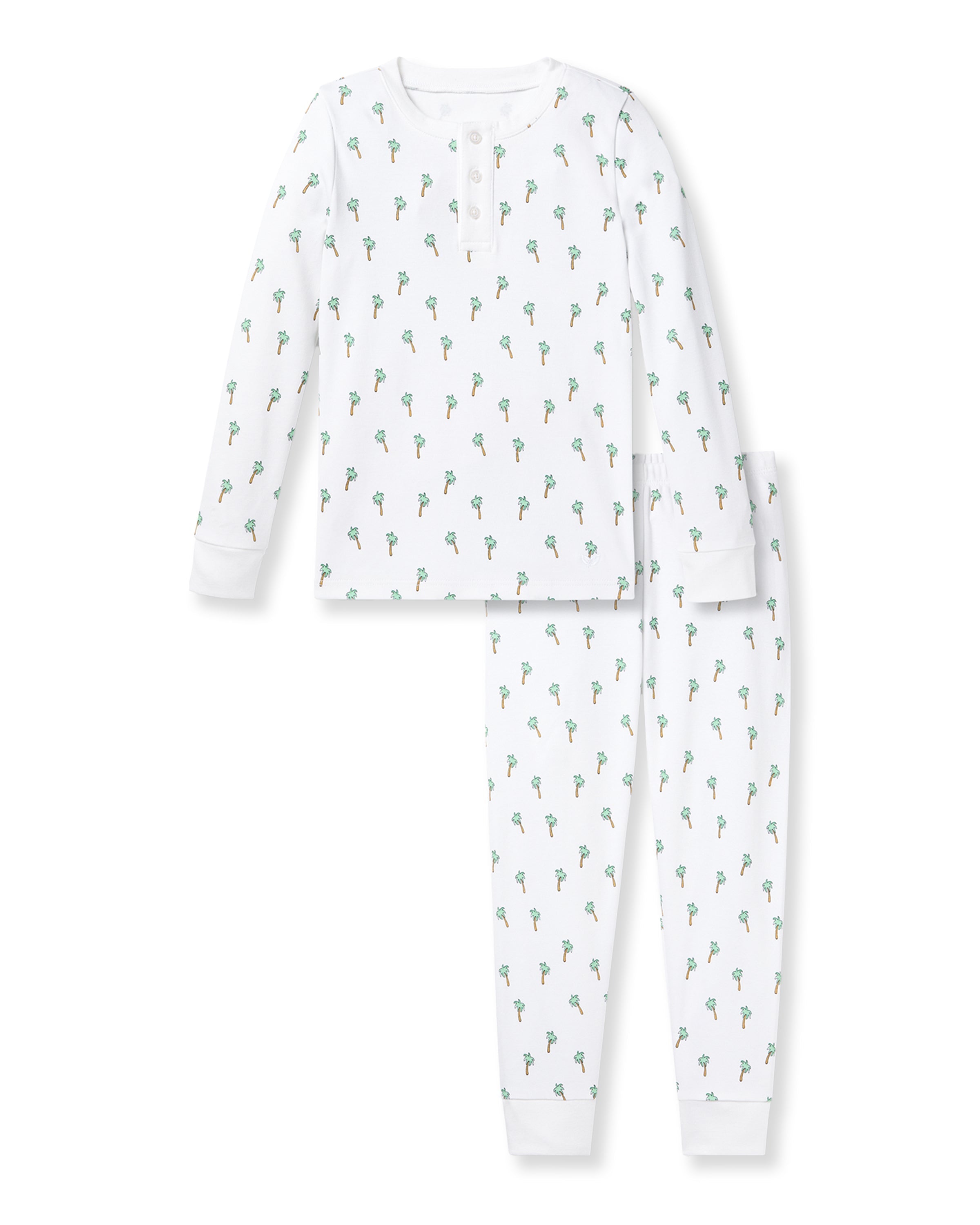The Kids Pima Snug Fit Pajama Set in Palmier by Petite Plume features a white long sleeve top and pants with small green and orange dinosaurs, crafted from soft Pima cotton for comfort, complete with a round neckline and buttons.
