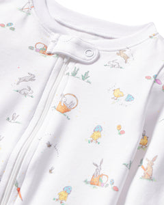 The Petite Plume Babys Pima Romper in Easter Frolic adds playfulness with its colorful rabbit, chick, egg, and plant illustrations. Made of soft Pima cotton, it features a zipper closure and small snaps at the top for easy dressing.