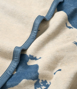 Cream and blue wool blanket with map design and blue binding edge detail.