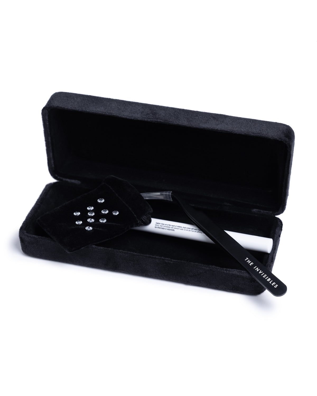Close-up of The Invisibles Party Experience showcasing rose cut diamond face gems in a black velvet case