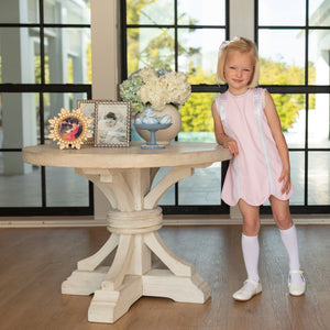Girl wearing the Henry Duvall Rosie Dress, a classic pink girls dress designed for spring celebrations and family portraits.