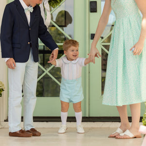 Toddler boy wearing the Henry Duvall Benjamin Button-On, a traditional heirloom-style outfit designed for special occasions and family photos.