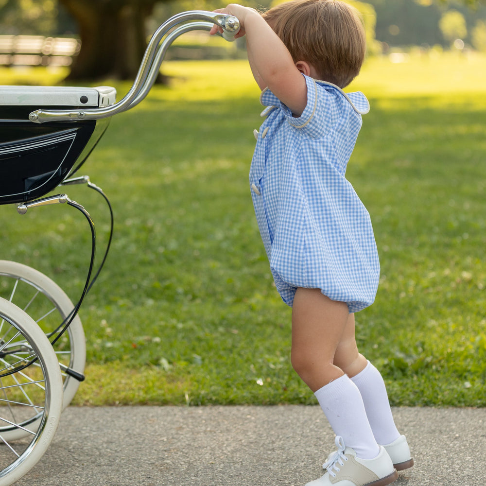 Side view of Banks Bubble romper in blue Charles Street check with khaki corduroy trim and covered snaps on toddler