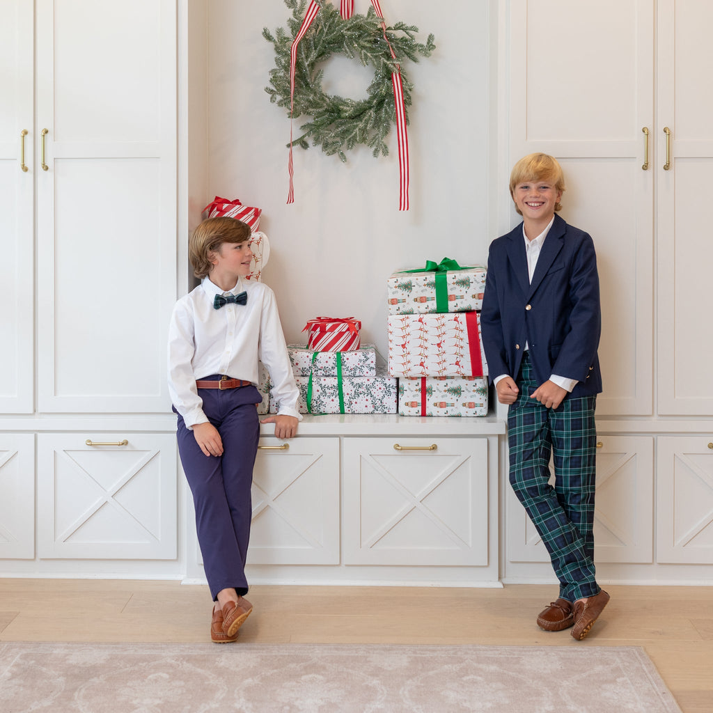 Boys holiday trousers in classic green and navy tartan, tailored Christmas pants for older boys with coordinating sibling outfits from Henry Duvall