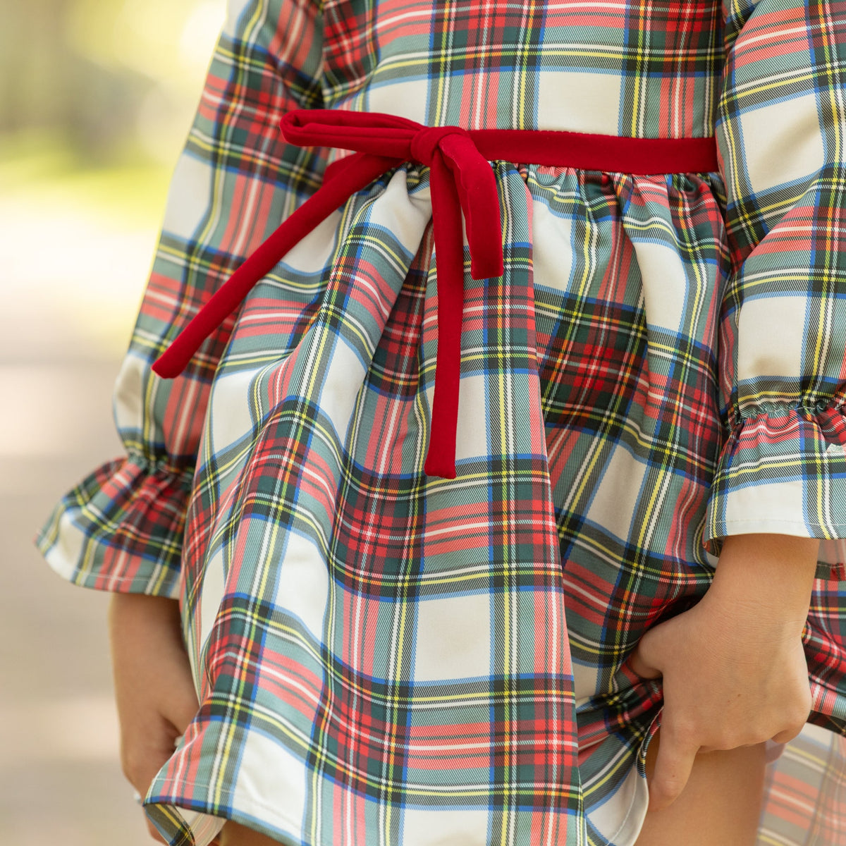 Girl's plaid holiday dress in Townsend Tartan with bow waist detail, vintage-inspired fit, perfect for family photos and festive gatherings – Henry Duvall classic