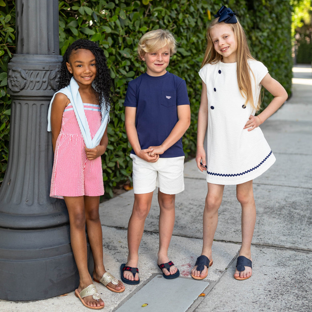 Front view of Liam Shorts in classic white seersucker on child model showing seersucker fabric and above the knee fit