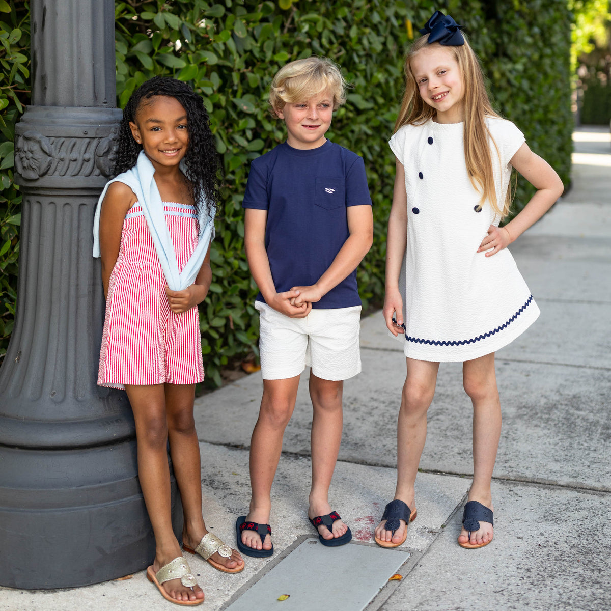 Front view of Liam Shorts in classic white seersucker on child model showing seersucker fabric and above the knee fit