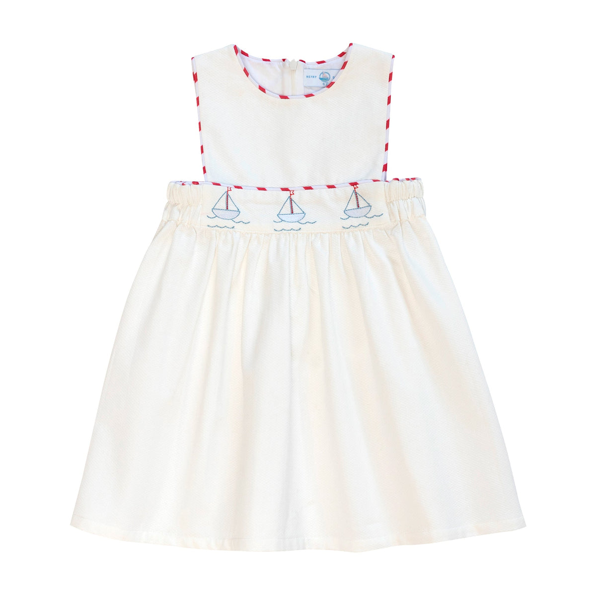 Front view of Leila Dress in Southampton Sailboats showcasing embroidered sailboats and red trim on a white background