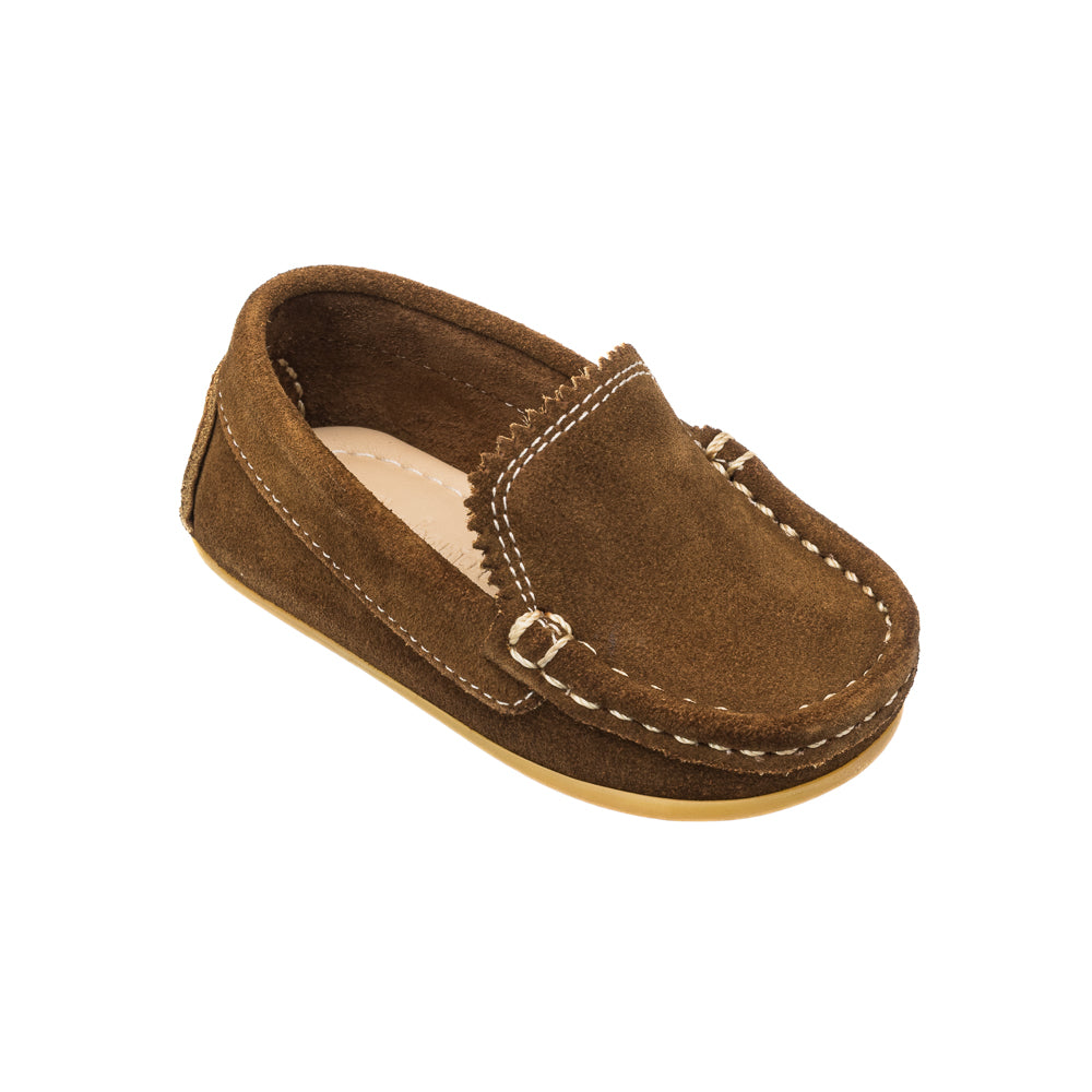 Three-quarter view of Toddler Antton Driver Moc in chestnut suede with hand-stitched seams on white