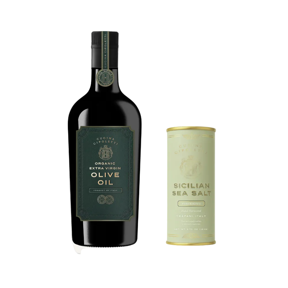 Front view of Cucina Cipoletti bundle: organic extra virgin olive oil bottle and Sicilian sea salt canister on white background