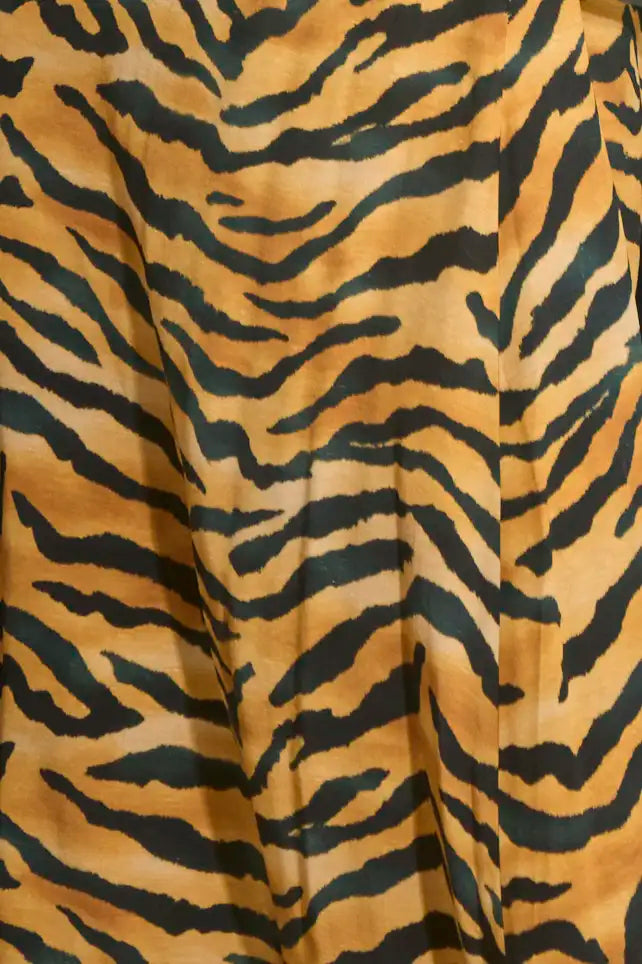 The Suki Skirt is in tiger print this season, with fitted pencil silhouette and easy pull-on design