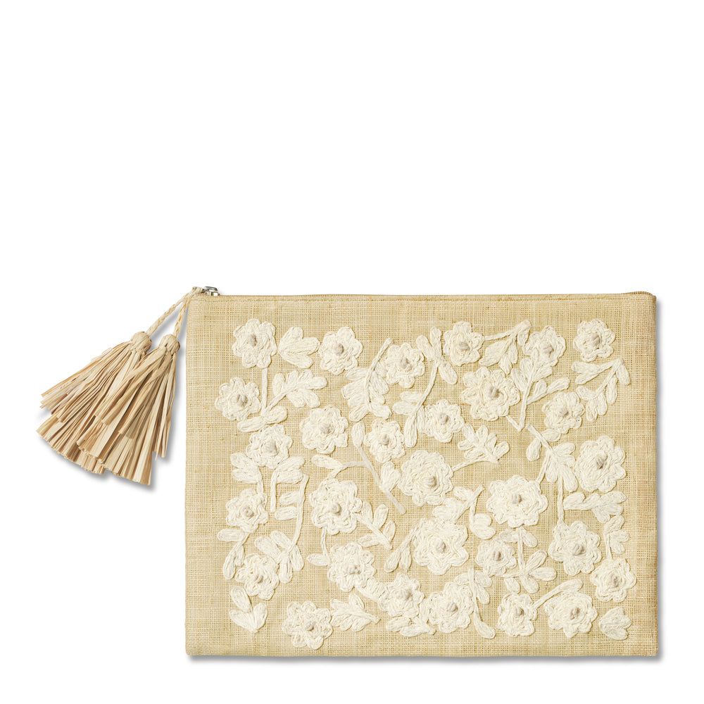 Front view of Thalia embroidered raffia pouch showing raised white floral embroidery and raffia tassel on white background
