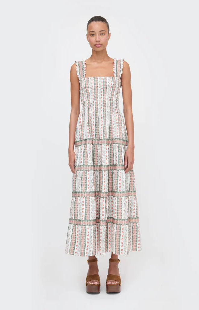 Front view of Kimmy Nap Dress in Cosmos Floral Stripe showing smocked bodice and tiered maxi skirt on light gray background