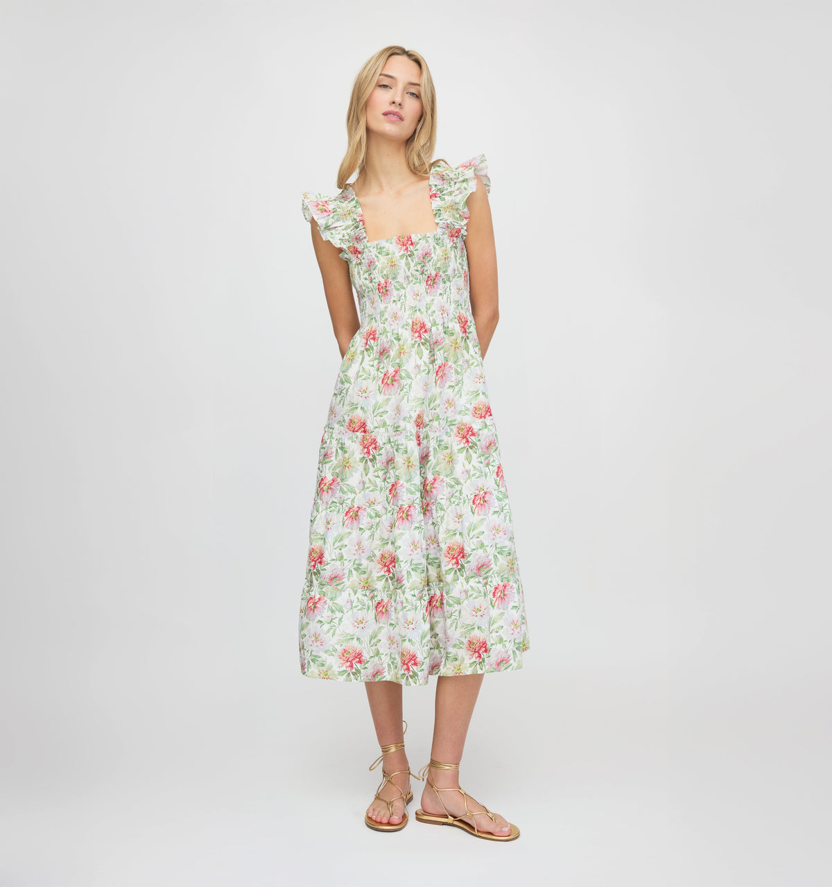 Front of Ellie Nap Dress showing smocked bodice, ruffled shoulders and tiered midi skirt in Peony Chintz on plain background