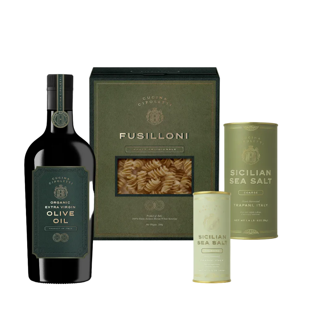 Front of The Full Range Bundle with organic extra virgin olive oil, Fusilloni pasta box, and two Sicilian sea salt tins on white background
