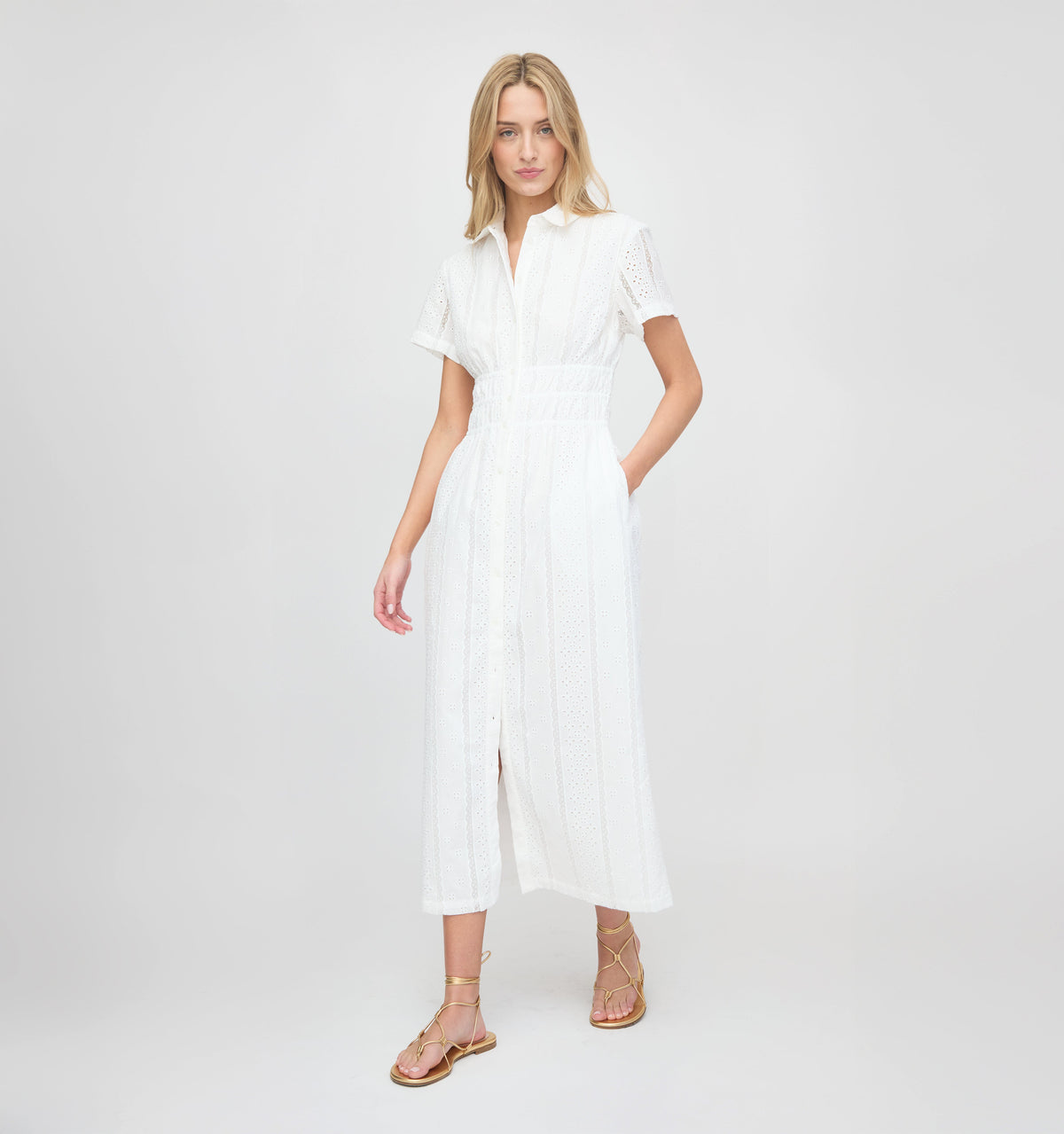 Front view of The Jamie Nap Dress in White Broderie Voile showcasing elasticated waist on a model against a light background